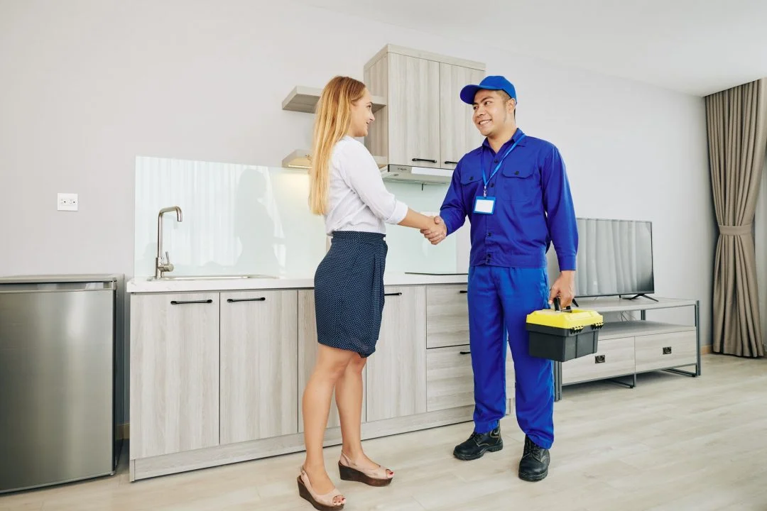 Service man shaking hands with woman